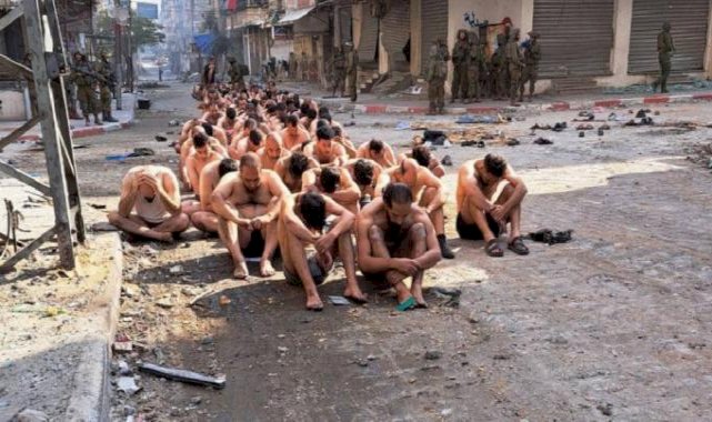 İsrail ordusu, Gazze'de Filistinlileri soyup kamyonlara bindirdi