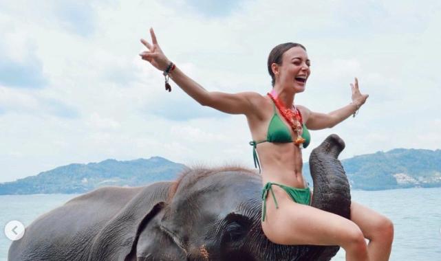 Oyuncu Rabia Soytürk'ün fille pozları olay oldu! Filin burnuna oturduğu kareye yorum yağdı