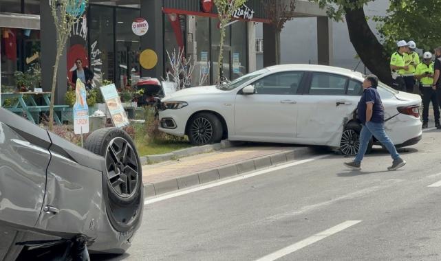 Bursa'da park halindeki otomobile çarpan araç takla attı