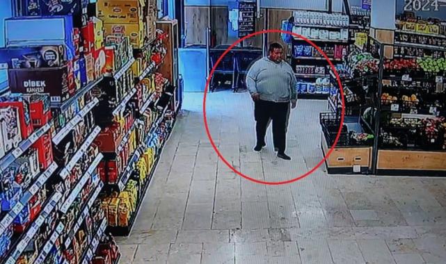 Hatay'da çamurlu ayakkabısını çıkartıp markete girdi